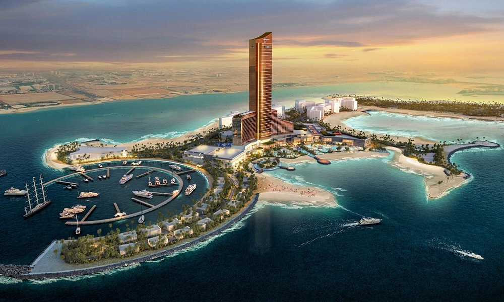 An aerial view of Wynn Island in Ras Al Khaimah, featuring a luxurious resort, waterfront villas, pristine beaches, a world-class casino, and stunning ocean views.